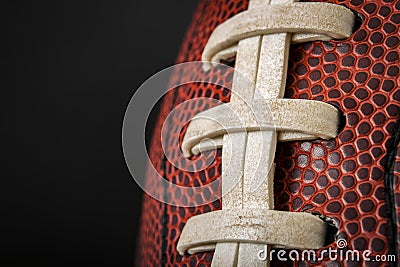 Vintage worn american football ball with visible laces, stitches and pigskin pattern Stock Photo