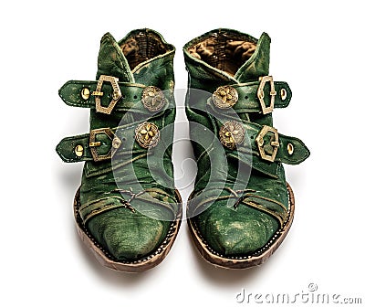 Vintage worn leprechaun shoes with gold buckles isolated on white Stock Photo