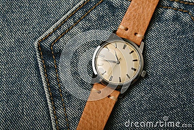 Vintage wristwatch with luxury italian leather strap and brown trendy oxford shoes. Classic timepiece mechanical watch. Stock Photo