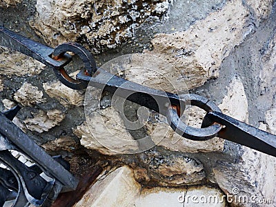 Vintage wrought iron forged chain rail and gate Stock Photo