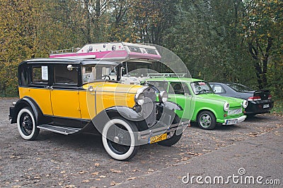 Vintage yellow car Ford A at a car show parked Editorial Stock Photo