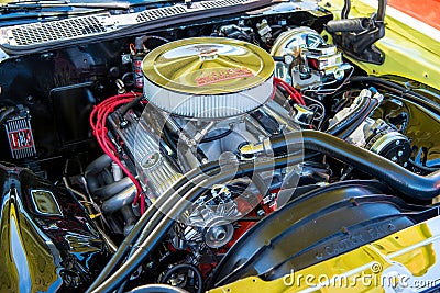 Vintage car with hood open showing a Unique Engine Editorial Stock Photo