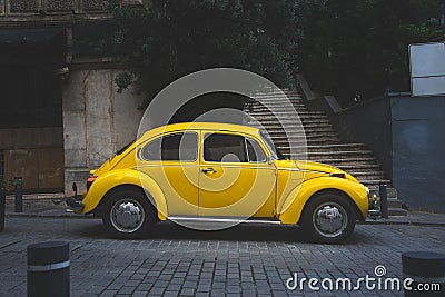 vintage yellow car parked outdoors. retro style. antique vehicle Editorial Stock Photo
