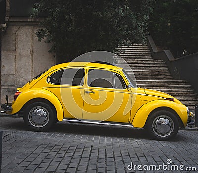 vintage yellow car parked outdoors. retro style. antique vehicle Editorial Stock Photo