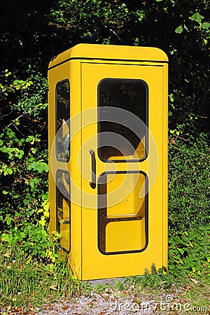 vintage yellow german phone box Stock Photo