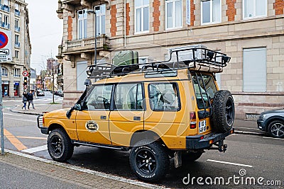 vintage yellow Land Rover Defender Camel Trophy parked in city Editorial Stock Photo