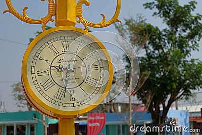 Vintage yellow street clock. Left frame. Editorial Stock Photo