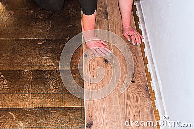 Vinyl laminate laying in old building Stock Photo