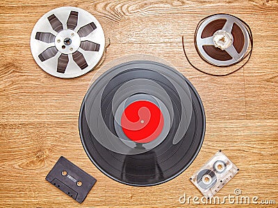 Vinyl record with cassetes and reel tape Stock Photo