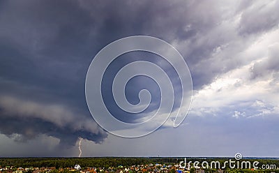 A violent thunderstorm with a hurricane and flashing lightning swept over the village. Stock Photo