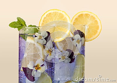 Violet drink with edible flowers Stock Photo