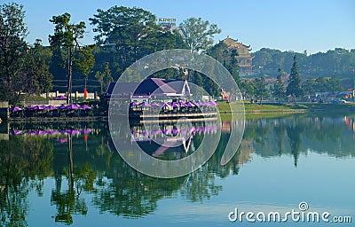 Violet lakeside coffee shop, parasol reflect on lake, Da Lat city center Editorial Stock Photo