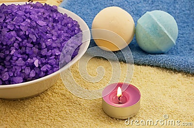 Violet salt with candle and bath balls Stock Photo