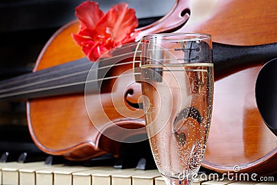 Violin and champagne. violin and piano. after the concert. Stock Photo