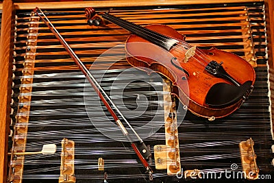 Violin on a cimbalom Stock Photo