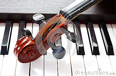 Violin and piano keyboard Stock Photo