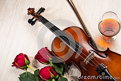 Violin, rose, glass of champagne and music books Stock Photo