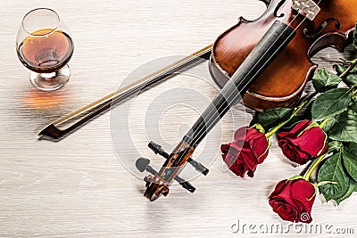 Violin, rose, glass of champagne and music books Stock Photo
