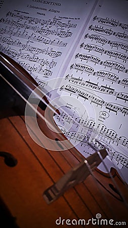Violin on a violin score Stock Photo