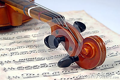 Violin Scroll With Miusic Sheet Stock Photo