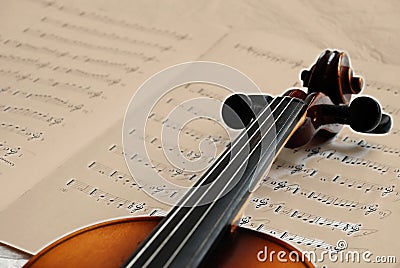 Violin on sepia music paper Stock Photo