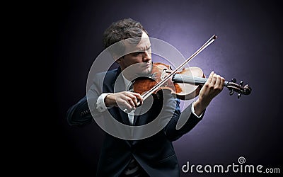 Violinst playing on instrument with empathy Stock Photo