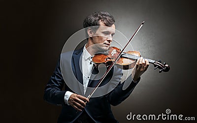 Violinst playing on instrument with empathy Stock Photo