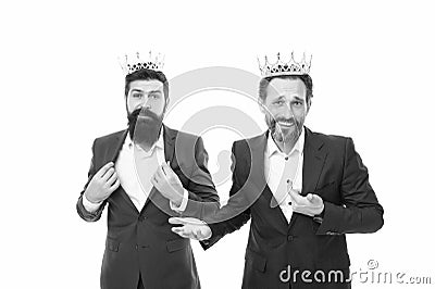 VIP concept. Rich and powerful people. Bearded men. Elite community. Royal benefits club. Men wear crowns. Businessmen Stock Photo