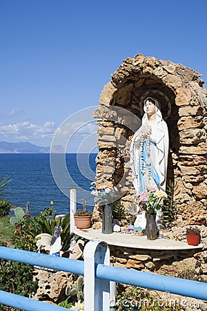 Virgin Mary on altar by the ocean on Via Marina, Trappeto, Sicily Stock Photo