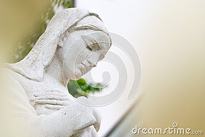 Virgin Mary statue in front of the Church of the Assumption of the Blessed Virgin Mary Editorial Stock Photo