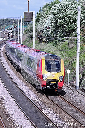 Virgin Voyager train on West Coast Main Line Editorial Stock Photo