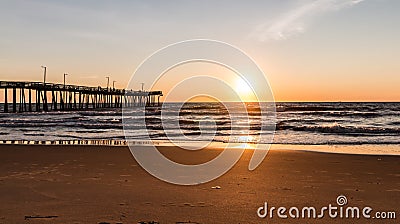 Virginia Beach Fishing Pier with Sun at Horizon Stock Photo