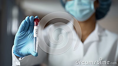 Virologists showing zika virus vaccine, conducting clinical trial based on DNA Stock Photo