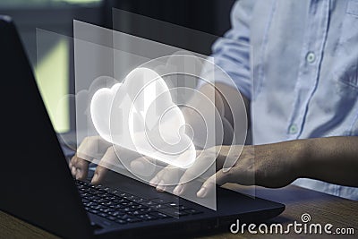 Virtual Cloud and technology icons , Businessman using laptop computer to control operations thru cloud computing system Editorial Stock Photo