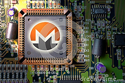 Cryptocurrency and blockchain - financial technology and internet money - circuit board mining and coin Monero XMR Editorial Stock Photo