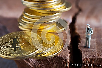 Virtual money Bitcoin cryptocurrency - halvings the Bitcoin currency - gold coin on the wooden background with a symbolical halvin Stock Photo