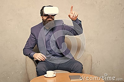 Virtual office and work space. Business implement modern technology. Businessman sit chair wear hmd explore virtual Stock Photo