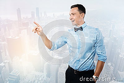 Delighted positive man using a sensory panel Stock Photo