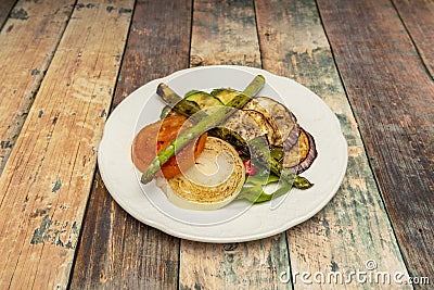 Virtually all vegetables can be grilled. Leeks, tomatoes Stock Photo