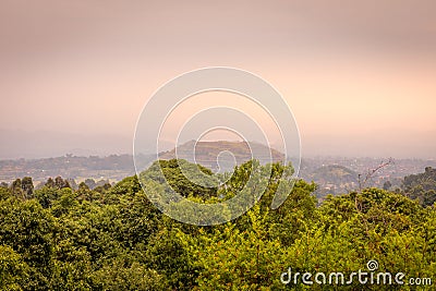 Virunga Volcanoes and Mgahinga Gorilla National Park from Kisoro in colorful early morning with mist in the valley. Kisoro Distric Stock Photo