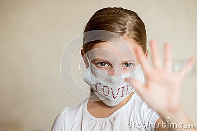 Virus mask girl wearing face protection in prevention for coronavirus showing gesture Stop Infection.Health protection Stock Photo