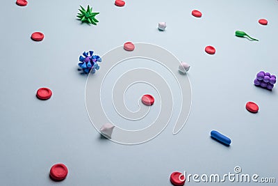 viruses in the blood. Medical flatlay of blood poisoning with viruses and bacteria on a blue background. View from above Stock Photo