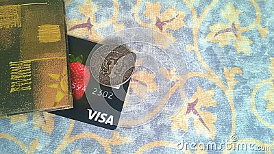 Visa bank card and half dollar coin Editorial Stock Photo