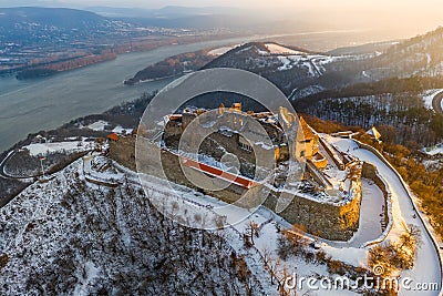 Visegrad, Hungary - Aerial view of the beautiful snowy high castle of Visegrad at sunrise with Dunakanyar Stock Photo