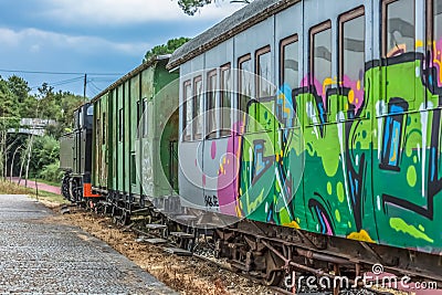 View of a abandoned older rustic train, wagon with graffiti street art Editorial Stock Photo