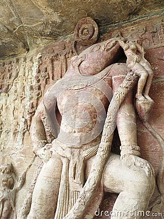 Vishnu in his incarnation as the man-boar Varaha, rescuing Bhudevi from the cosmic ocean on his tusk, Udayagiri Caves, India Stock Photo