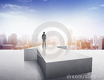 Vision concept. Successful businessman standing on arrow and looking over city Editorial Stock Photo