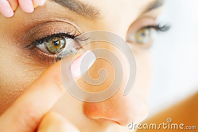 Vision Contact Lenses. Closeup With Beautiful Woman Face Stock Photo