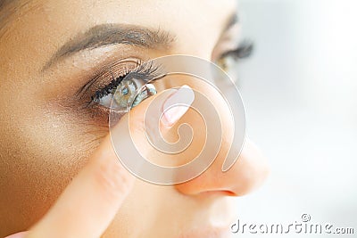 Vision Contact Lenses. Closeup With Beautiful Woman Face Stock Photo