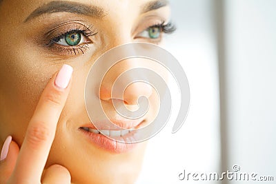 Vision Contact Lenses. Closeup With Beautiful Woman Face Stock Photo